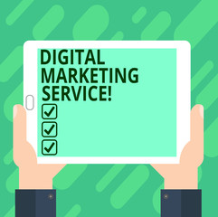 Conceptual hand writing showing Digital Marketing Service. Business photo text services using digital channels to reach consumers Hu analysis Hand Holding Tablet Smartphone Display Unit photo