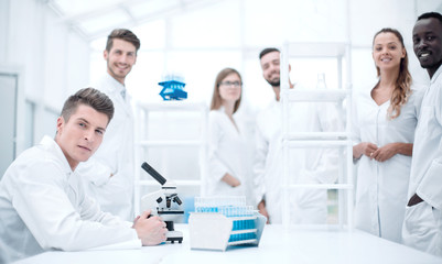 Male Scientist Working With Microscope
