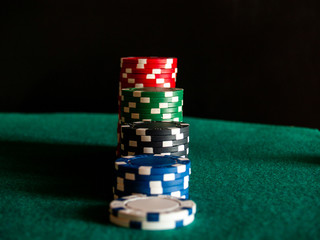 Several piles of poker chips of various colors