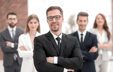 confident businessman in front of his business team.