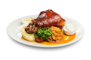 baked leg of lamb with sauces and a runner of stewed cabbage and mashed potatoes