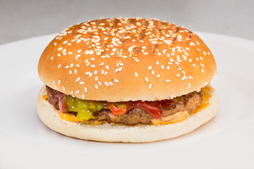 Burger with bun and sesame