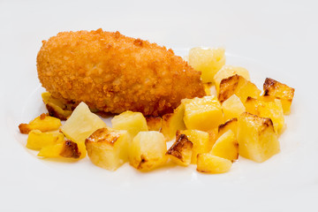 chicken Kiev with fried potatoes