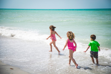 Children playing in ocean