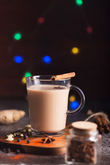 Masala chai tea on the dark background. Hot indian beverage with spices. Image with copy space