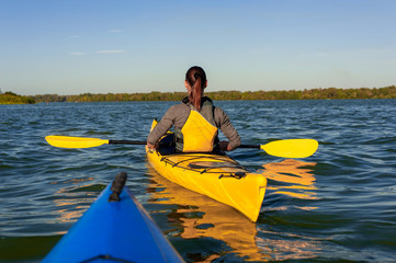 girl on a kayak on the river