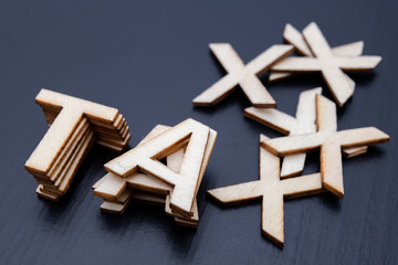 The inscription is arranged from letters cut out of wood on the table. The word – tax.