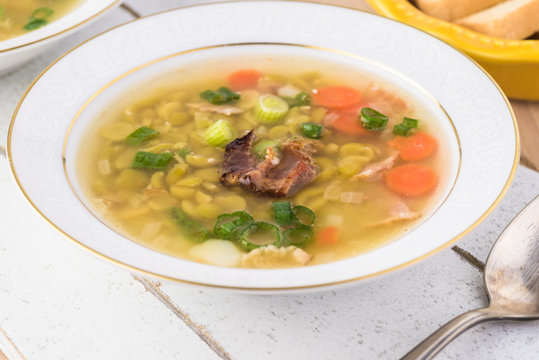 Homemade pea soup with smoked bacon.