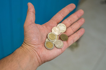 hand holding colombian banknotes of thousands of pesos, different cash value