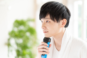 portrait of young asian man skin care image