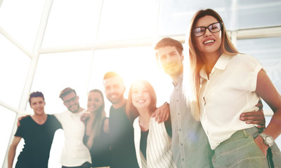 group of young people standing in the new office