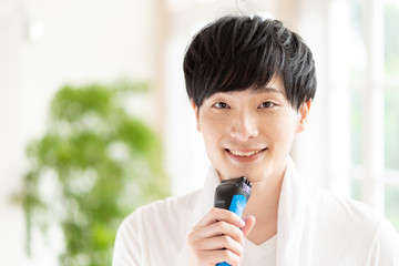 portrait of young asian man skin care image
