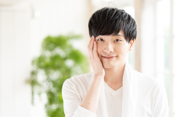 portrait of young asian man skin care image