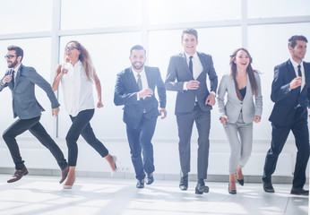 business team running together