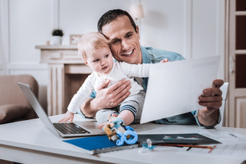 Joyful positive man working