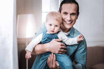 Happy joyful father looking at you