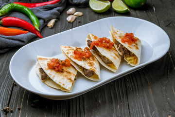 Quesadilla with beef and sauces