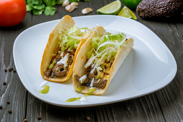 Mexican tacos with beef and guacamole