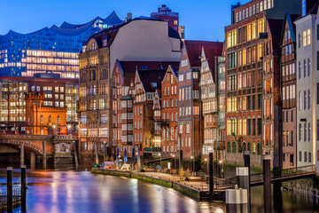 The Nikolaifleet in Hamburg, Germany, at dusk. It is a canal in the old town (Altstadt) and is...