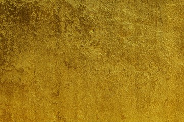 Background of plastered walls with gold paint