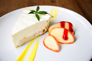 Coconut cake on white plate on table
