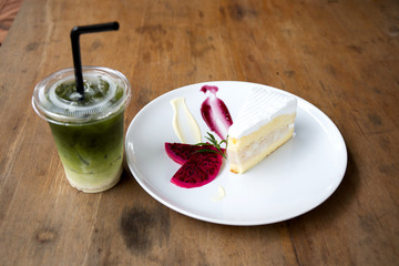 Coconut cake on white plate on table