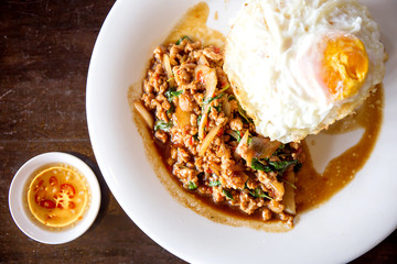 Rice topped with stir-fried minced pork and basil with Fried egg