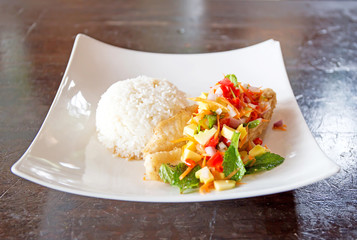 Soft rice and grilled fish Dolly bento with vegetables, selective focus.