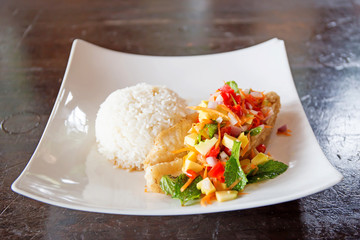 Soft rice and grilled fish Dolly bento with vegetables, selective focus.