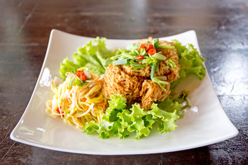 Crispy Catfish Salad Served white plate