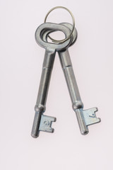 An Old-Fashioned Key on a White Background