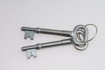 An Old-Fashioned Key on a White Background