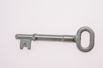 An Old-Fashioned Key on a White Background