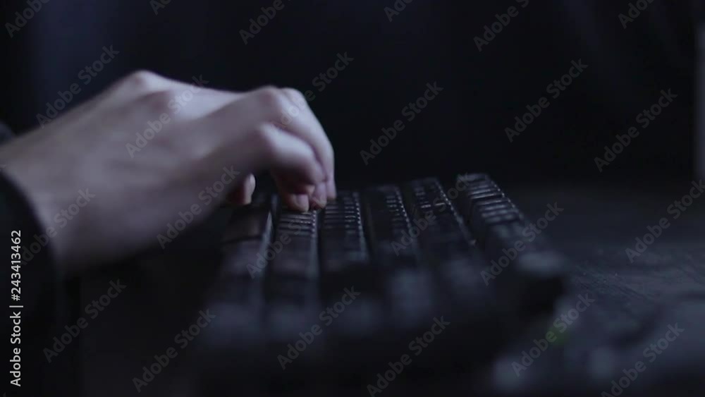 Poster shallow focus low angle view across hands typing on multimedia keyboard.
