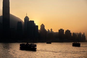 Silhouette of Hong Kong Victoria Harbour. During sunset; vintage style
