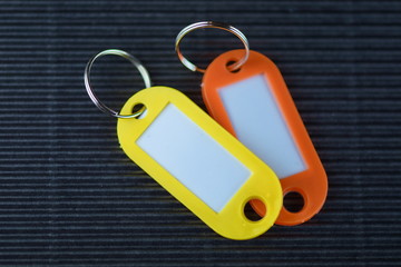 colorful plastic name tag on black  background