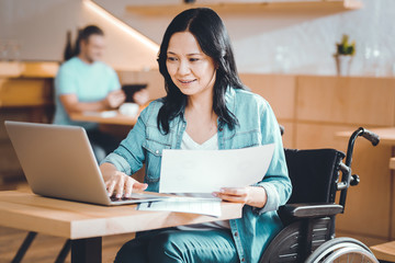 Disabled freelancer working in a cafe