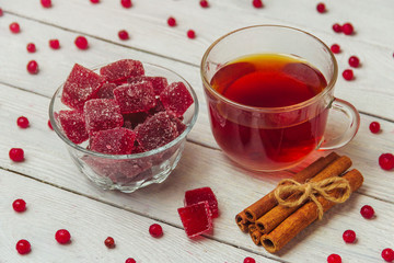 Homemade cranberry marmalade on a light background