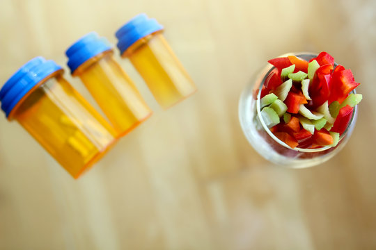 Choice between  pills and vegetables