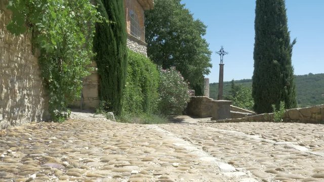 Cobble Stone Road France with Cross in Background