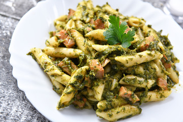 Penne pasta with spinach and meat