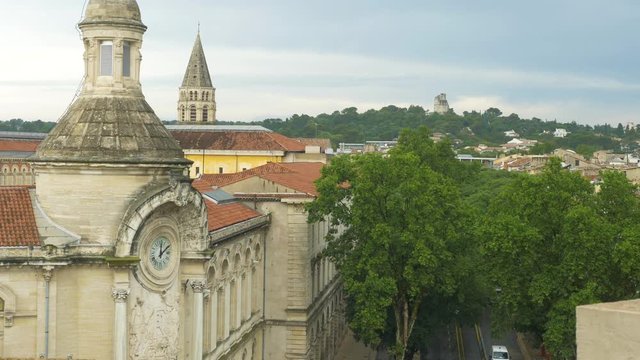 N&icirc;meFrance Rooftops with Clock, tree tops castle in distance partial road