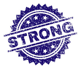 STRONG stamp seal watermark with distress style. Blue vector rubber print of STRONG caption with corroded texture.