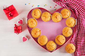 Muffins with pumpkin. Cupcakes with Valentine's Day decor. Flat lay. Top view.