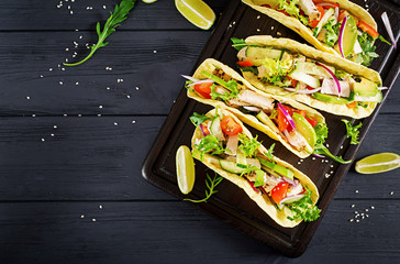 Mexican tacos with chicken meat, avocado, tomato, cucumber and red onion. Healthy tortilla. Wrap...