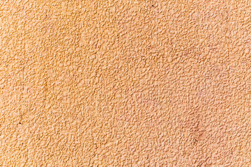 painted wall of small stone chips