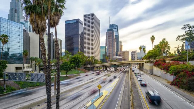 Time lapse freeway traffic in downtown Los Angeles at sunset