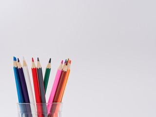 colored pencils sharpened on a white background.