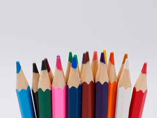 colored pencils sharpened on a white background.