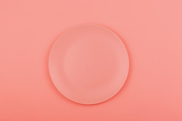 Pink plate on the pink background